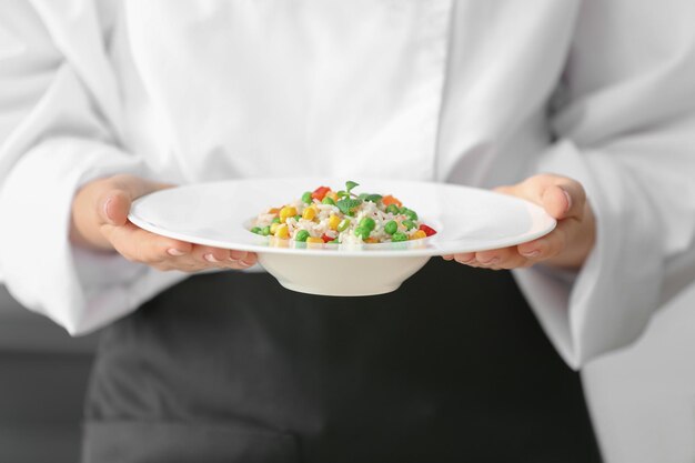 Chef arranging a plated dish